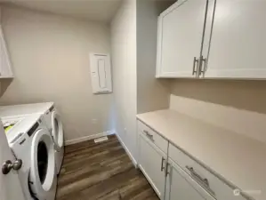 Laundry room with folding table and plenty of storage