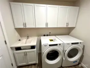 Laundry room also has utility sink