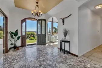 Grand entry with marble floors.
