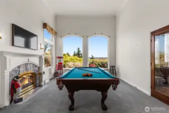 family/additional living room complete with fireplace & great views.