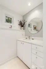 Crisp, clean & sharp! Half bath/powder room off kitchen.