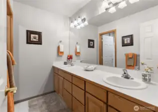 Full upstairs guest bathroom with separate shower and toilet room.