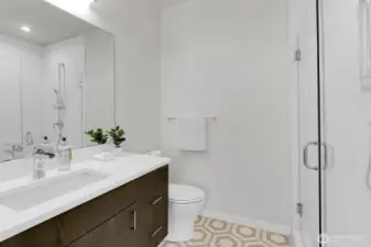 Huge shower in with designer tile flooring in Primary en-suite bathroom