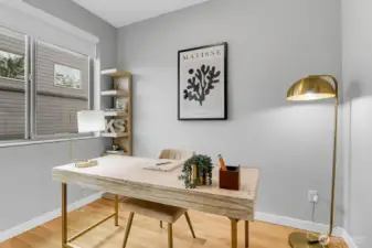 2nd bedroom with full closet on upper floor staged as den/office