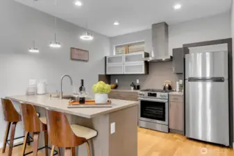 Modern kitchen with center island & quality SS appliances
