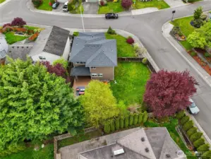 Stunning bird's-eye view of the property, showcasing the spacious yard and prime location