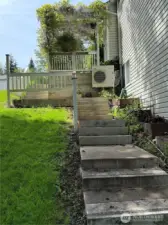 Stairs take you all the way to the backyard and small creek.