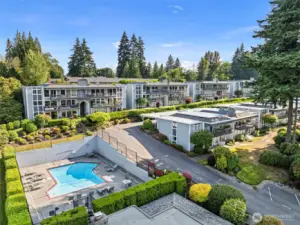 Aerial view of condo community and pool.