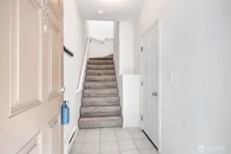 No one lives above you or below you.  Shared common wall is your hallway.