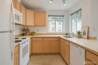 Kitchen with tons of natural lighting and an abundance of storage. Virtually Staged.