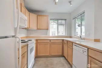 Kitchen has lots of storage and counter space.