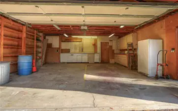 Interior of two car detached garage with loads of storage space