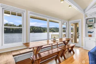 This dining table was made by a local artist...it conveys with the home; fits perfectly! Large coved ceilings with skylights add to the interesting architecture of this home.  Step outside from the dining table and onto a spacious deck; look out for seals, eagles, and the occasional Orca!