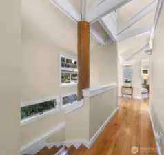 Hallway leading to downstairs bedroom, flex room, bathroom and utility room.