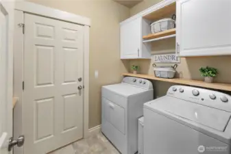 Laundry Room w/ Storage Cabinets, Shelving, Sink and Counter space to fold clothes. Garage access too.