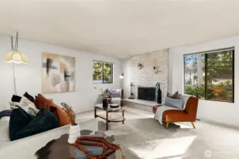 Open main living space with wood-burning fireplace.