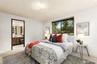 Primary bedroom offers private ensuite.