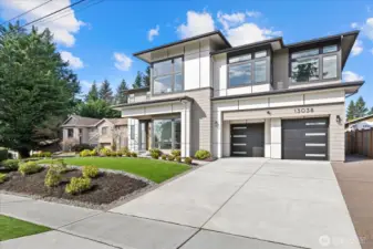 Refined from the very first glance, this home makes an unforgettable entrance with striking modern curb appeal, manicured turf grounds, and a presence that feels both rare and effortless.