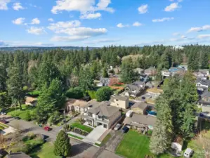 Nestled into a lush Kirkland setting surrounded by mature evergreens, this residence offers a rare balance of modern architecture, neighborhood charm, and everyday privacy.