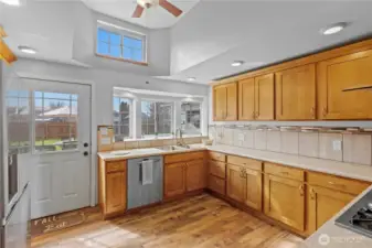 Spacious kitchen with wraparound cabinetry and efficient workflow—ideal for both everyday living and hosting guests.