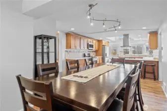 Large dining area with modern farmhouse touches and open-concept design for seamless entertaining.
