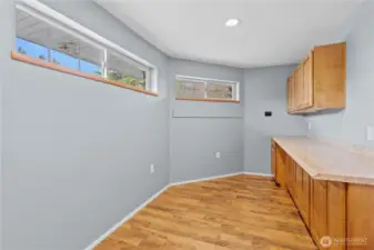 Versatile utility room with built-in storage—ideal for laundry, organization, or additional workspace