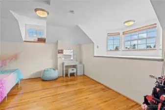 Additional upper-level room with natural light and versatile use options.