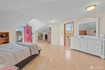 Expanded primary suite with room for seating area or workspace.