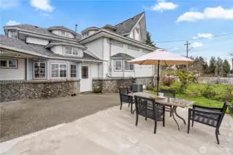 Beautiful backyard with patio, string lights, and entertaining space—classic Pacific Northwest outdoor living.