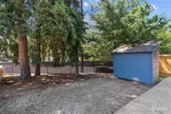 Very large, fully fenced side yard accessed off mudroom.