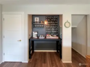 Main level Living room also features a nice wet bar or coffee corner.  Notice the updated interior 3-panel doors?