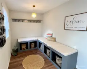 Main level entry features bench seating and plenty of room to hang those wet beach/clamming clothes.  Bench is detached but can be included in the sale of the home upon request.