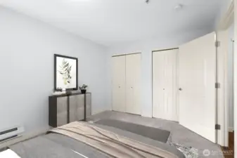 Second bedroom. The entire east-facing wall features double-doors to a closet with built-ins