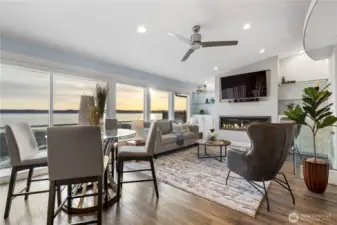 Great room spanned by windows and a slider to the deck & patio.