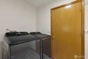 Washer and dryer included! The main level laundry room is situated between the great room and the garage, offering a convenient place to drop shoes, bags, and worries before coming home.