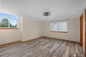 2nd view of primary bedroom without staging