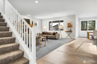 Family room and stairs. Pictures depict a previously built home similar to the home going to be built on this lot. Floor plans, Elevations, colors, upgrades & materials may be different.