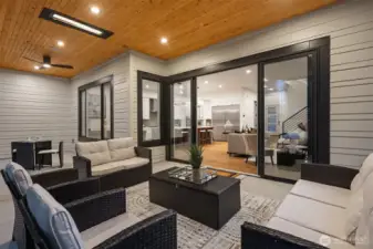 12-Foot, Four-Panel Sliding Glass Door Opens to the Patio, Creating a Seamless Indoor-Outdoor  Living Experience