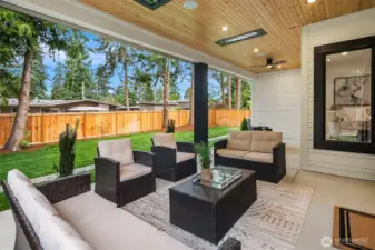 Expansive Outdoor Living Area with Built-In Infratech Heaters & Ceiling Fan for Year-Round  Enjoyment