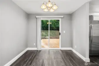 Flexible space-dining room, computer/office space, coffee bar, etc leading to backyard.