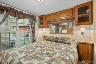 Primary bedroom located at the back of the park model. Built-ins and closet space.