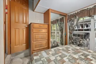 Primary bedroom located at the back of the park model. Built-ins and closet space.