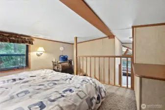 Loft space with storage and sleeping space.