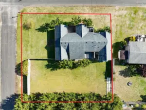 Double lot with fenced back yard.