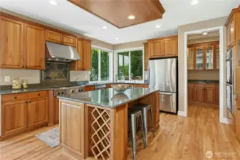 Chef’s kitchen features slab granite counters