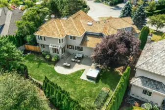Set on a half-acre+ lot backing to lush greenspace with Cascade Mountain views