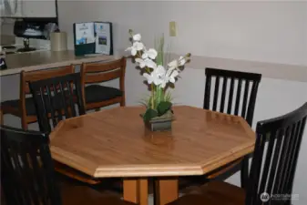 Dining area with more seating at the kitchen bar.