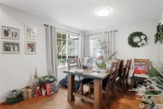 Spacious dining area with wood floors.
