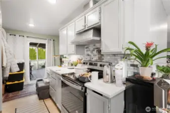 At the back of the kitchen is access to the back covered patio area that has a water pond feature (not currently in use).