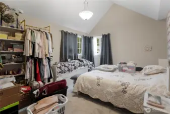 Primary Bedroom features vaulted ceilings...